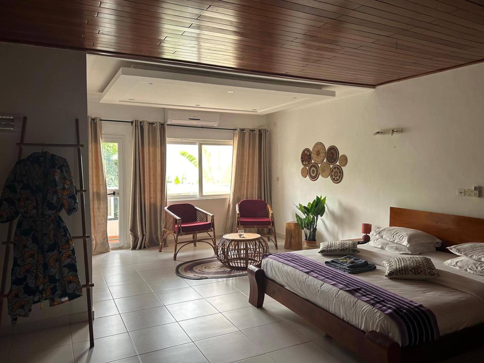L'Oasis Guesthouse Cotonou Exteriör bild